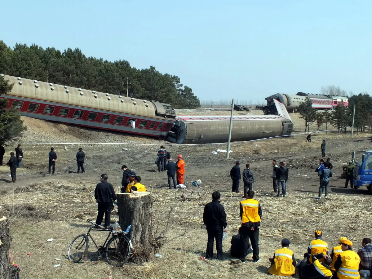 Rescuers work at the site where a train derailed on April 13, 2014, in the Hailun country of Suihua City, Heilongjiang province of China. (ChinaFotoPress/Getty Images)