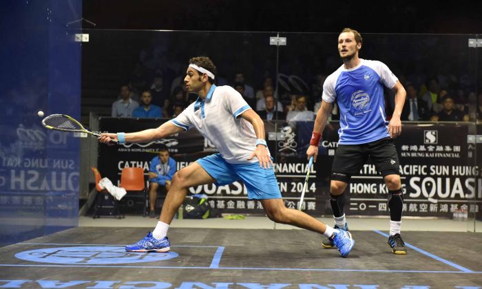 Mohamed Elshorbagy of Egypt plays a forehand volley during his match against Gregory Gaultier of France during the Final of the Hong Kong Squash Open 2014 at the HKPSC on Sunday Aug 31, 2014. Elshorbagy won the match 3 games to 2. (Bill Cox/Epoch Times)