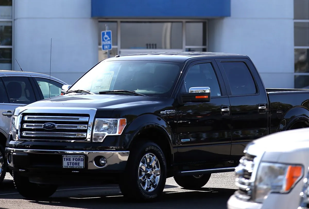 A 2014 Ford F-150 pickup truck is displayed on the sales lot. (Justin Sullivan/Getty Images)