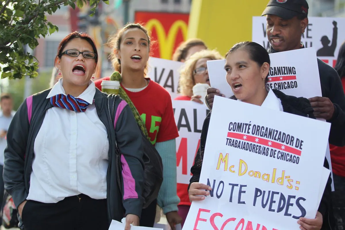 Fast food workers and activists demonstrate outside McDonald's downtown flagship restaurant in Chicago on July 31. (Scott Olson/Getty Images)