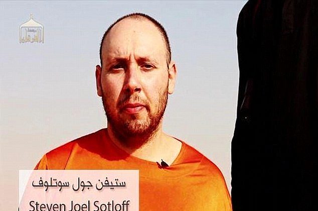 This still image from an undated video released by the Islamic State extremists on Tuesday purports to show journalist Steven Sotloff being held by the terrorist group.