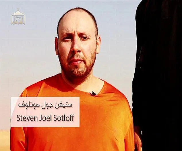 This still image from an undated video released by the Islamic State extremists on Tuesday purports to show journalist Steven Sotloff being held by the terrorist group.