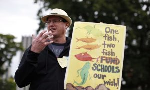 Clark Urges Teachers' Union Suspend Strike, Union Vows Indefinite Unrest 