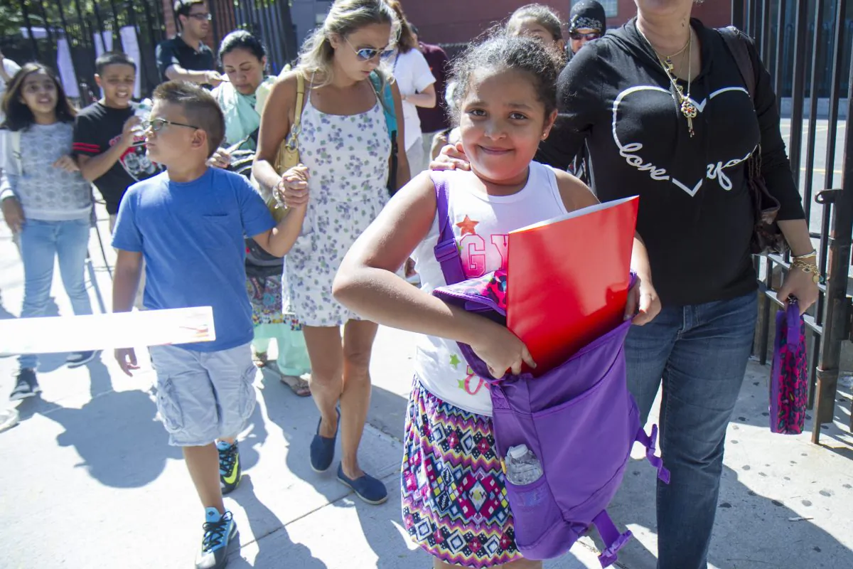 Students and their parents at P.S. 234 after their first day of school in Astoria, New York, Sept. 4, 2014. (Samira Bouaou/Epoch Times)