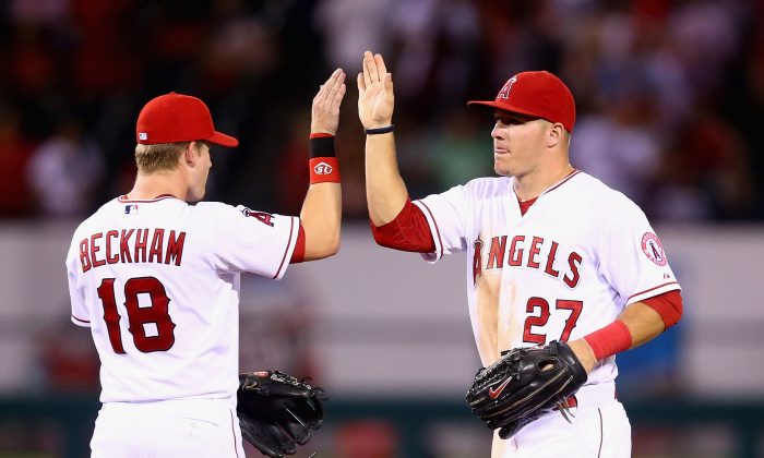 Gordon Beckham (L) and MVP candidate Mike Trout of the Los Angeles Angels, in this Aug 27, 2014 photo, have the Angels in the driver's seat in the American League. (Jeff Gross/Getty Images)