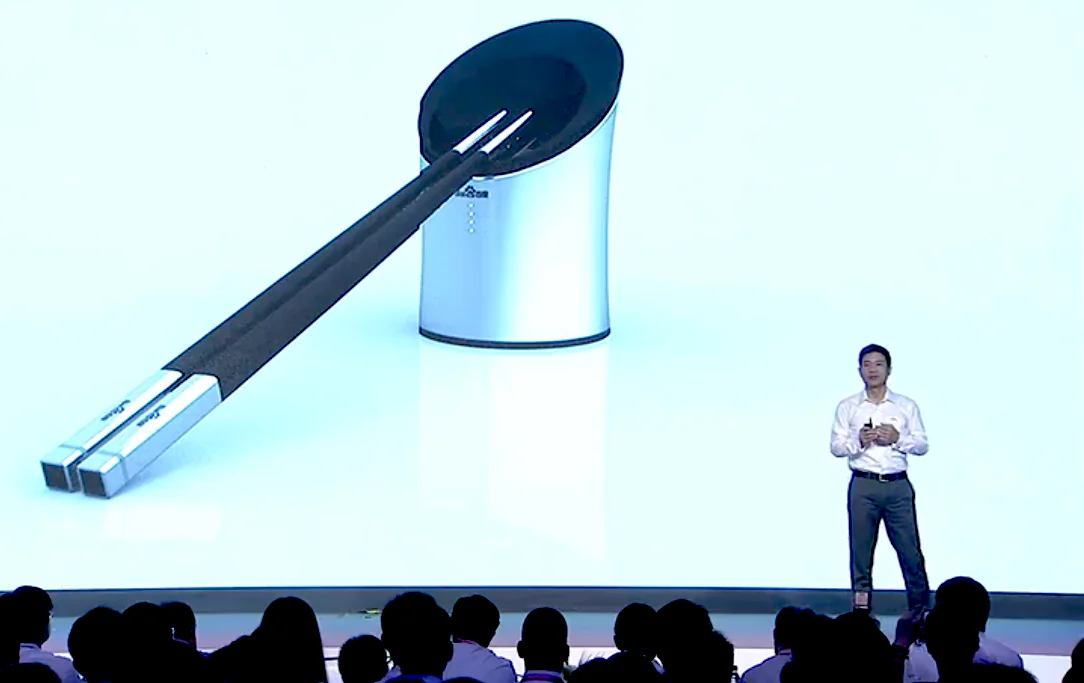 Robin Li, chairman and chief executive officer of Baidu Inc., introduces the Smart Chopsticks at the Baidu Technology Innovation Conference 2014 in Beijing on Sept. 3, 2014. The device was invented in response to the regular food safety scandals in China. (Screenshot/Baiduworld)