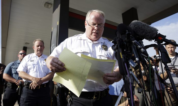 Ferguson Police Chief Thomas Jackson releases the name of the the officer accused of fatally shooting Michael Brown,  an unarmed black teenager, Friday, Aug. 15, 2014, in Ferguson, Mo. (AP Photo/Jeff Roberson)