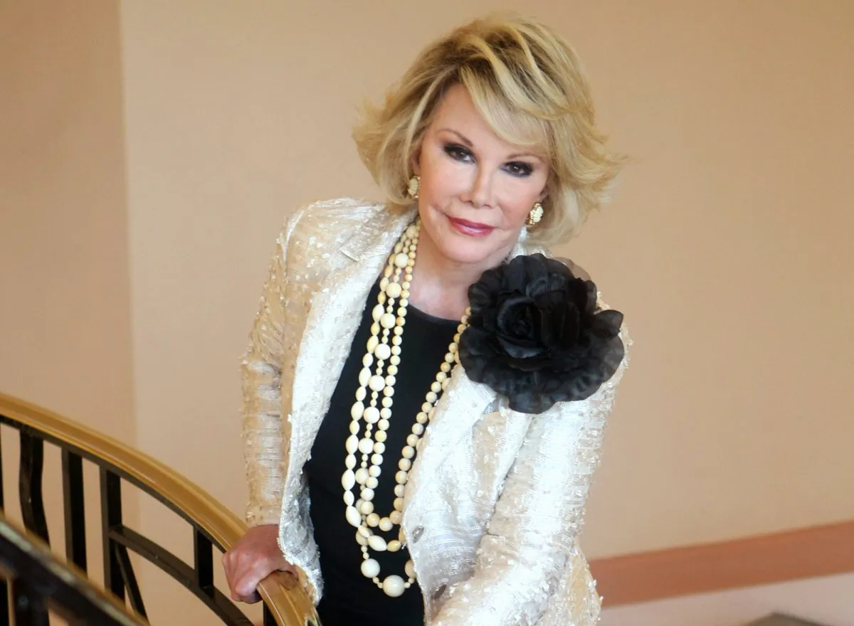 FILE - This Oct. 5, 2009 file photo shows Joan Rivers posing as she presents "Comedy Roast with Joan Rivers " during the 25th MIPCOM (International Film and Programme Market for TV, Video, Cable and Satellite) in Cannes, southeastern France. In October 1986, Rivers made TV history as the first woman hosting a late-night broadcast talk show. She was the first face of the Fox network, headlining its first program, "The Late Show Starring Joan Rivers."  (AP Photo/Lionel Cironneau, File)