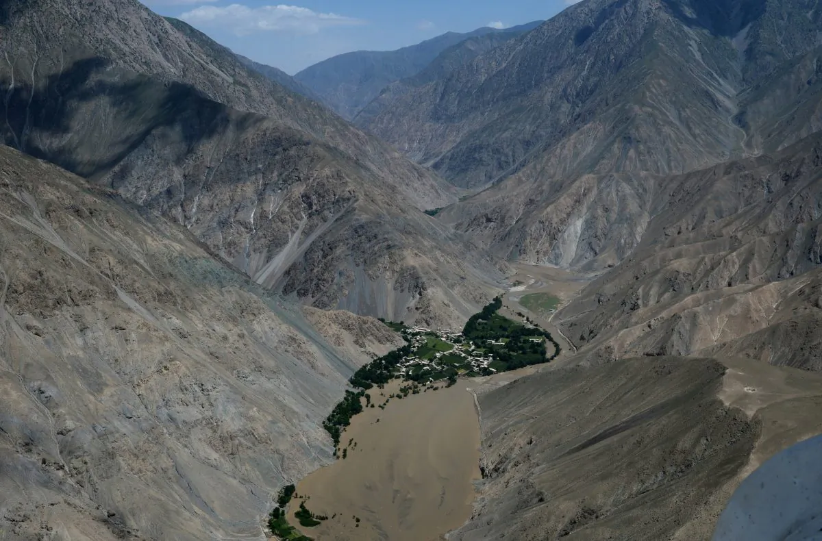 Mud from a landslide caused by flooding is seen in this aerial view of Afghanistan's Guzargah-e-Nur district of Baghlan province on June 9, 2014. Rescuers scrambled to deliver food and medical supplies to Afghan families marooned on mountaintops after flash floods killed 80 people in a remote northern district, washing away hundreds of homes and forcing thousands to flee. (Wakil Kohsar/AFP/Getty Images)