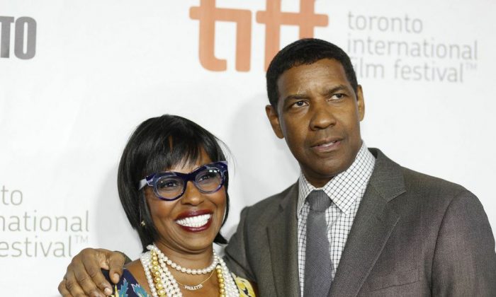 Actor Denzel Washington and wife Paulette Washington attend the red carpet premiere of "The Equalizer" at the Toronto International Film Festival (TIFF) on September 7, 2014. (Eric Sun/Epoch Times)