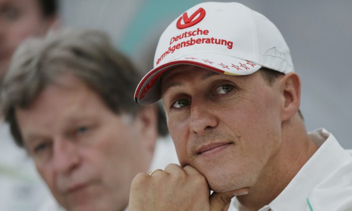 Former Mercedes F1 driver Michael Schumacher of Germany pauses during a news conference to announce his retirement from Formula One at the end of 2012 in Suzuka, Japan, Oct. 4, 2012. (AP Photo/Shizuo Kambayashi, File)