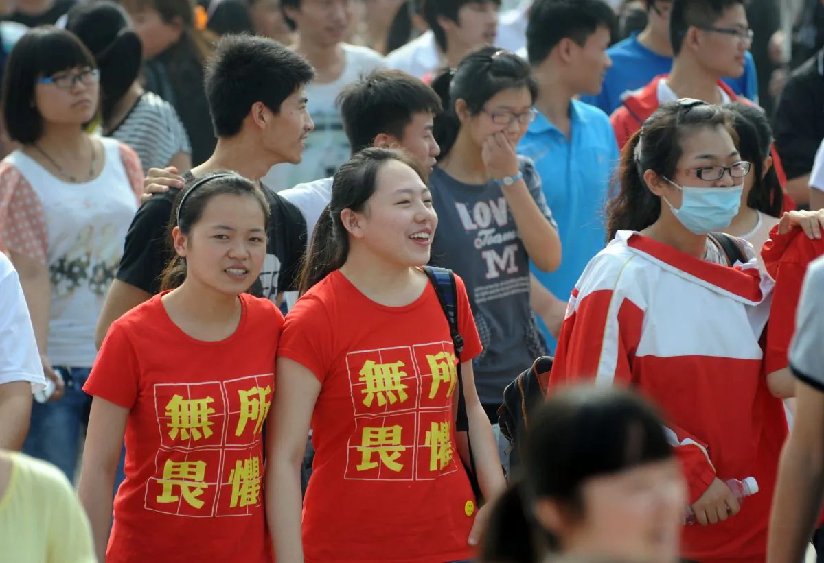 Two female students wear T-shirts saying “fear nothing” before entering the exam room for the college entrance exam in China, or the “gaokao,” in Bozhou, east China's Anhui Province, on June 7, 2014. (AFP/AFP/Getty Images)