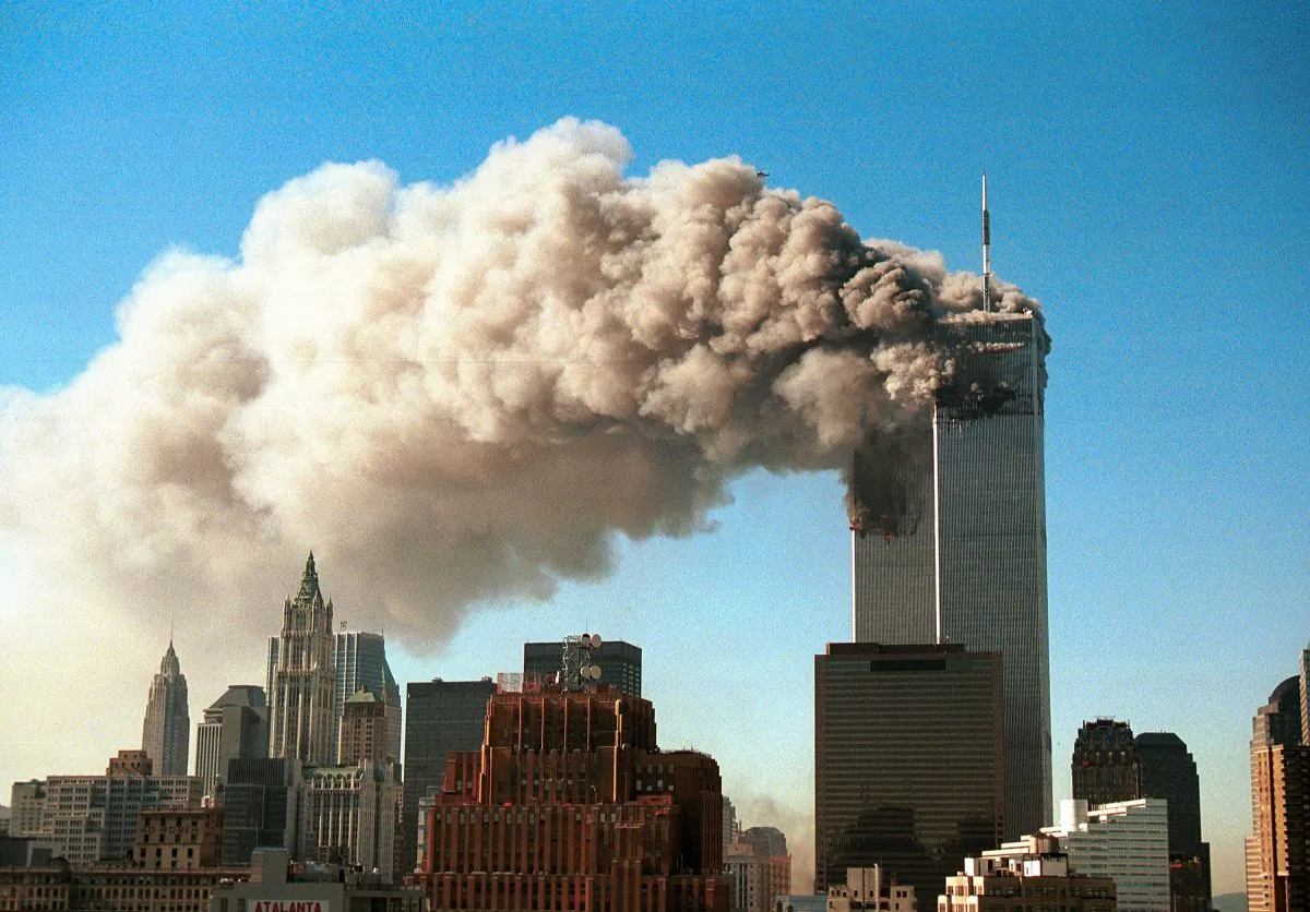 9/11: Smoke pours from the twin towers of the World Trade Center after they were hit by two hijacked airliners in a terrorist attack in N.Y., on Sept. 11, 2001. (Robert Giroux/Getty Images)