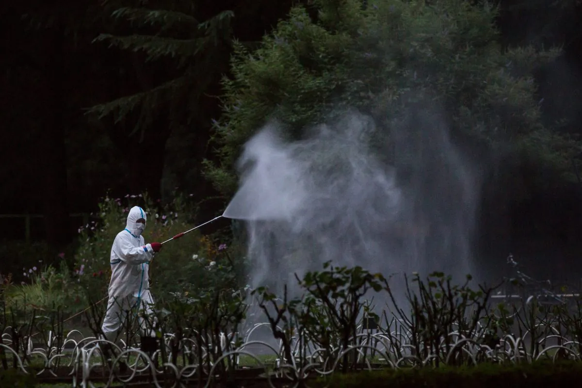 A workman sprays pesticide in Tokyo, Japan, on Aug. 28, 2014. The number of dengue fever cases has reached 1755 in southern China’s Guangdong Province by Sept. 9, exceeding the total annual number for previous years. (Chris McGrath/Getty Images)
