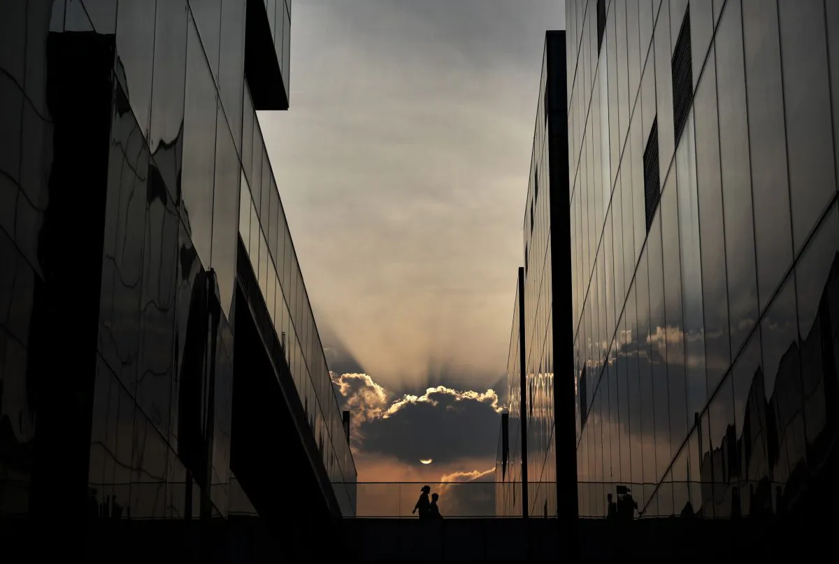 A Chinese couple walk together while shopping at an outdoor mall in the evening on Sept. 5, 2014, in Beijing, China. (Kevin Frayer/Getty Images)