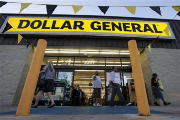 Customers exit a Dollar General store, in San Antonio. Dollar General is going hostile with its $9.1 billion bid for Family Dollar after repeated rejections of previous offers by its rival. (AP Photo/Eric Gay)