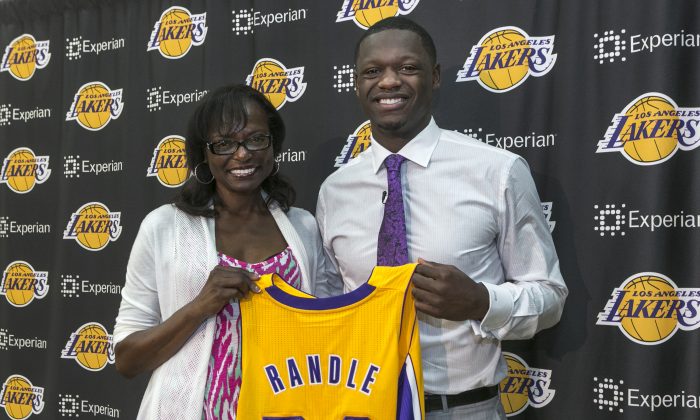 Los Angeles Lakers forward Julius Randle poses with his mother, Carolyn Voyles, in this file photo. Randle and Jeremy Lin may not start for the Lakers in the upcoming 2014-15 season. (AP Images)