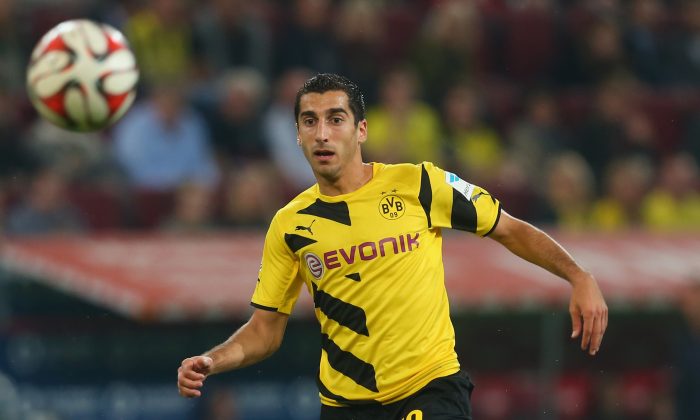 Henrikh Mkhitaryan of Dortmund runs with the ball during the Bundesliga match between FC Augsburg and BVB Borussia Dortmund at SGL Arena on August 29, 2014 in Augsburg, Germany. (Photo by Alexander Hassenstein/Bongarts/Getty Images)