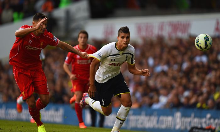 Dejan Lovren of Liverpool pulls on the shirt of Erik Lamela of Spurs during the Barclays Premier League match between Tottenham Hotspur and Liverpool at White Hart Lane on August 31, 2014 in London, England. (Photo by Jamie McDonald/Getty Images)