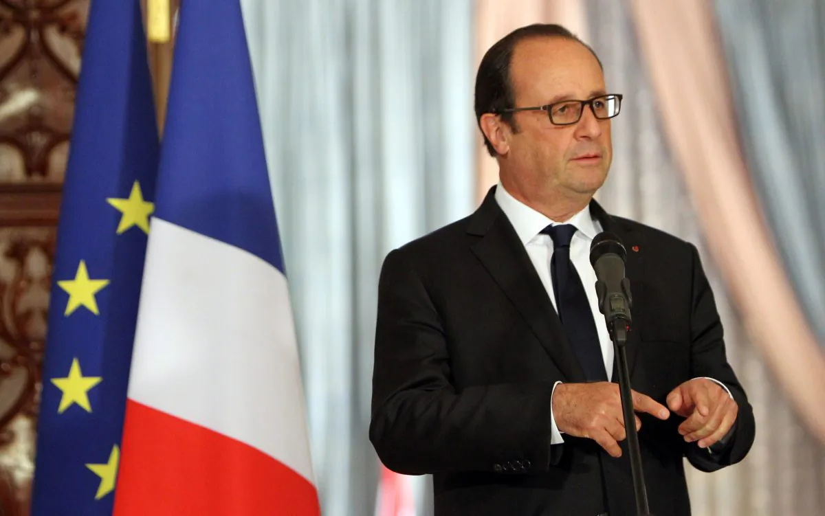 French President Francois Hollande gestures during a joint news conference with his Iraqi counterpart Fouad Massoum in Baghdad on Friday, Sept. 12, 2014. (AP Photo/Ali al-Saadi)