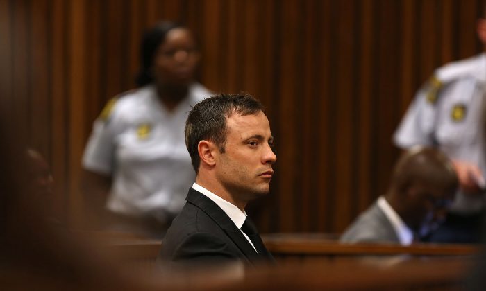 Oscar Pistorius looks ahead as he sits in court in Pretoria, South Africa, on Sept. 12, 2014. In passing judgement judge Thokozile Masipa ruled out a murder conviction for the double-amputee Olympian in the shooting death of his girlfriend, Reeva Steenkamp, but said he was negligent and convicted him of culpable homicide. (AP Photo/Alon Skuy)