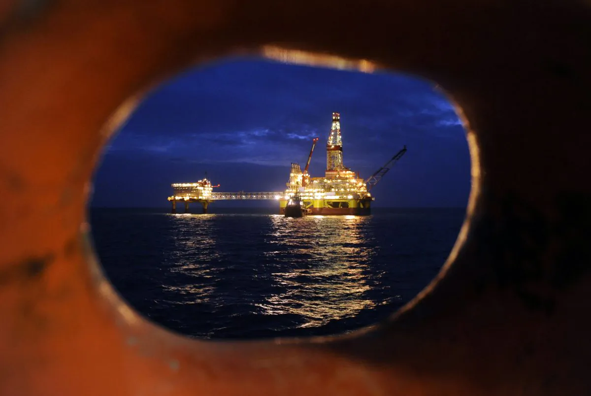 Russian LUKOIL ice-resistant fixed platform LSP-1 built to drill and operate wells and collect and pre-treat reservoir content at Korchagin's oil field in the Russian sector of the Caspian Sea in this file photo. A joint venture with Russian oil company OAO Rosneft has ended with new sanctions against Russia. (Mikhail Mordasov/AFP/Getty Images)