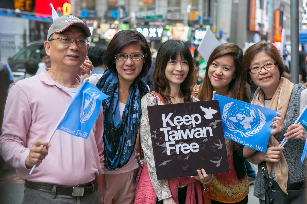 Demonstrators hold signs and flags during the Keep Taiwan Free rally on Times Square in Manhattan on Sept. 13, 2014. (Benjamin Chasteen/Epoch Times)