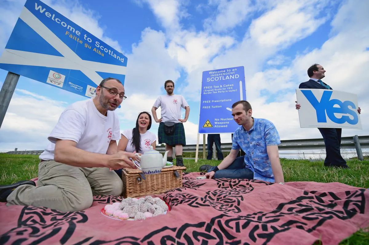 Members of English Scots for Yes hold a border tea party, to celebrate the continuing open border between Scotland and England after a possible “Yes” vote in the Scottish Independence referendum in Berwick Upon Tweed, England, on Sept. 7. (Jeff J Mitchell/Getty Images)