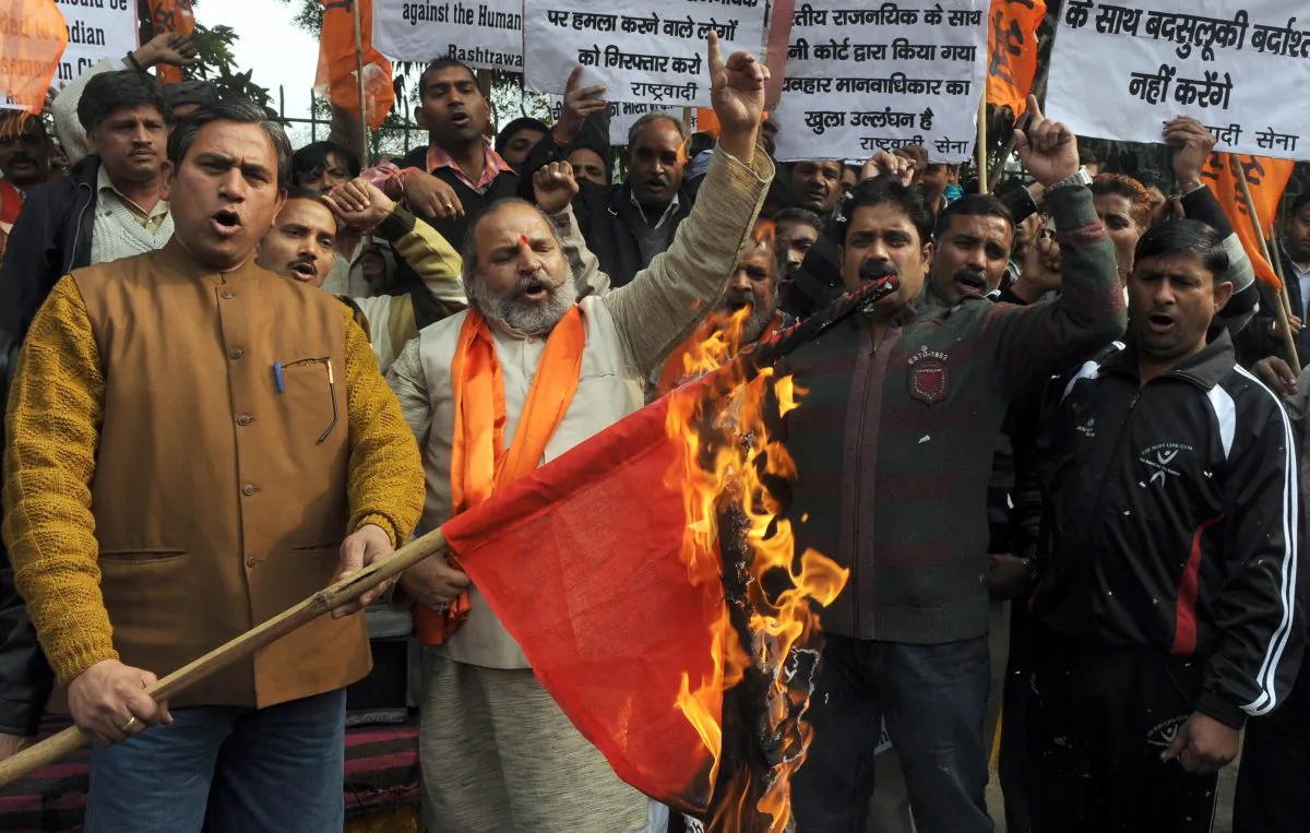 Activists of the Indian right-wing Hindu organization Shiv Sena shout slogans as they burn a China national flag while protesting land grabs by China in Ladakh during a demonstration in Amritsar on April 25, 2013. On Monday, the Chinese army again transgressed into the Ladakh region just days before Chinese leader Xi Jinping's scheduled visit to India. (Narinder Nanu/AFP/Getty Images)