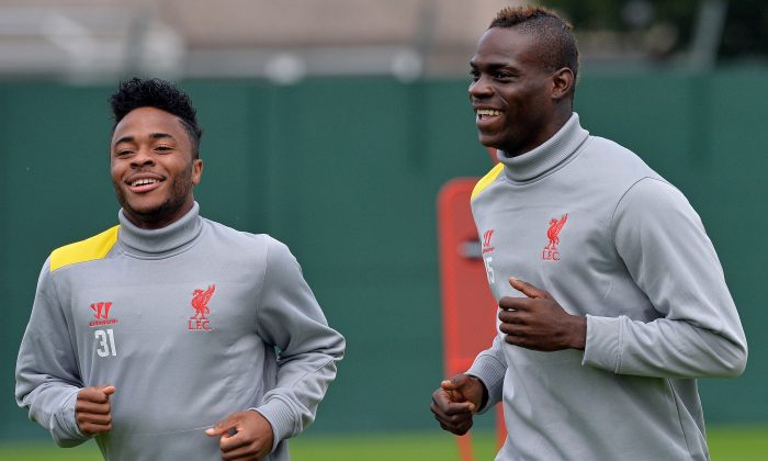 Liverpool's English midfielder Raheem Sterling (L) and Italian forward Mario Balotelli run during a training session at their Melwood training ground in Liverpool, north-west England, on September 15, 2014, ahead of their UEFA Champions League match against Ludogorets at Anfield. (PAUL ELLIS/AFP/Getty Images)