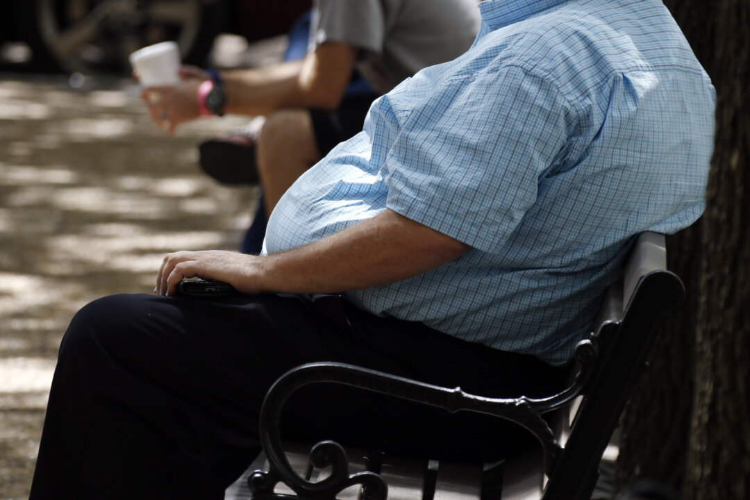 An overweight man rests on a bench in Jackson, Miss., on Sept. 4, 2014. (Rogelio V. Solis/AP Photo)