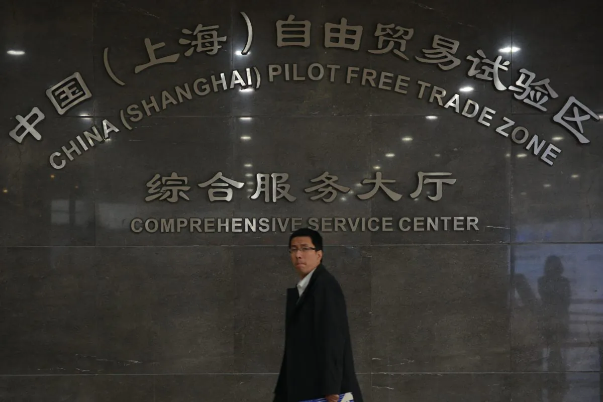 A visitor walks through the service center of the Shanghai Free Trade Zone on Nov. 28, 2013. The head of the project was recently removed on corruption charges. (Peter Parks/AFP/Getty Images)