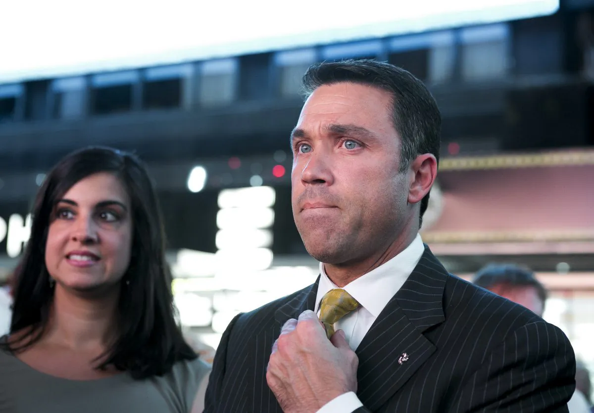 New York State Assembly member Nicole Malliotakis (L) and United States Congressman Michael Grimm join families in Times Square to support pediatric cancer awareness on Sept. 2. (Samira Bouaou/Epoch Times)