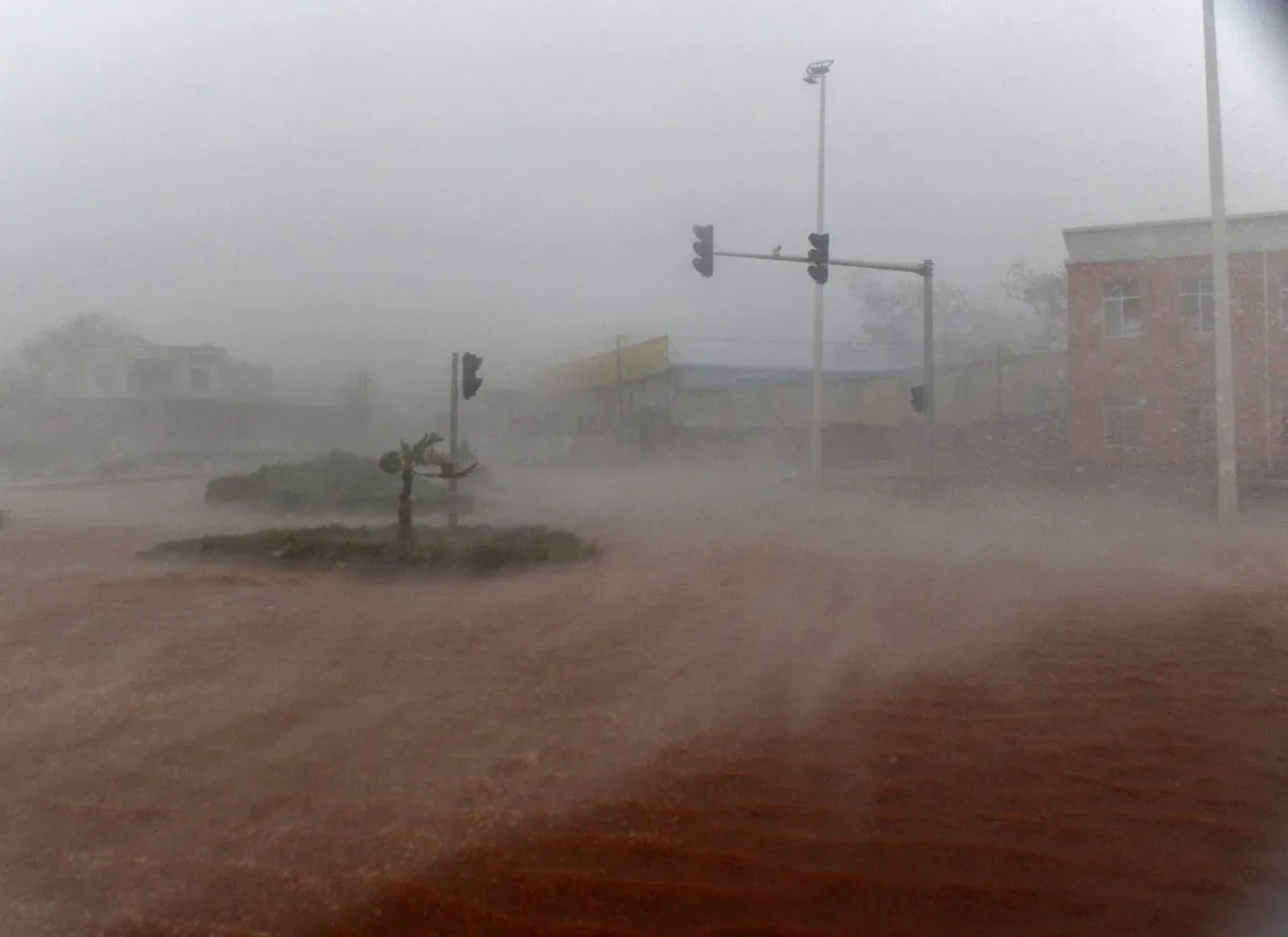 Rainstorm and floodwater submerge the street in Zhanjiang, Guangdong province on Sept. 16, 2014. A powerful typhoon "Seagull" slammed into China's Hainan, Guangdong, and Guangxi Province, impacting six million people. (STR/AFP/Getty Images)