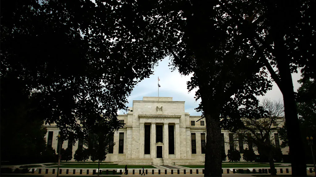 The Federal Reserve can be seen from in between trees on the National Mall Sept. 16, 2008, in Washington, DC. (Chip Somodevilla/Getty Images)