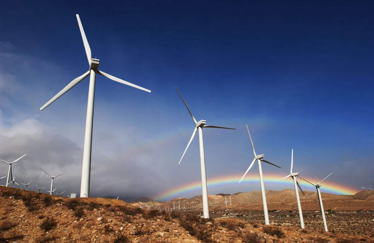 The first storm of the season produces a rainbow behind wind turbines in the San Gorgonio Pass near Palm Springs, Calif., in this file photo. (David McNew/Getty Images)