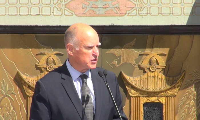 California Governor Jerry Brown makes a speech at the signing ceremony for AB 1839 on Sept. 18 at the TLC Chinese Theatre in Hollywood, Calif. The measure will increase tax incentives for film and television production in the state. (Wen Xue/NTD News)