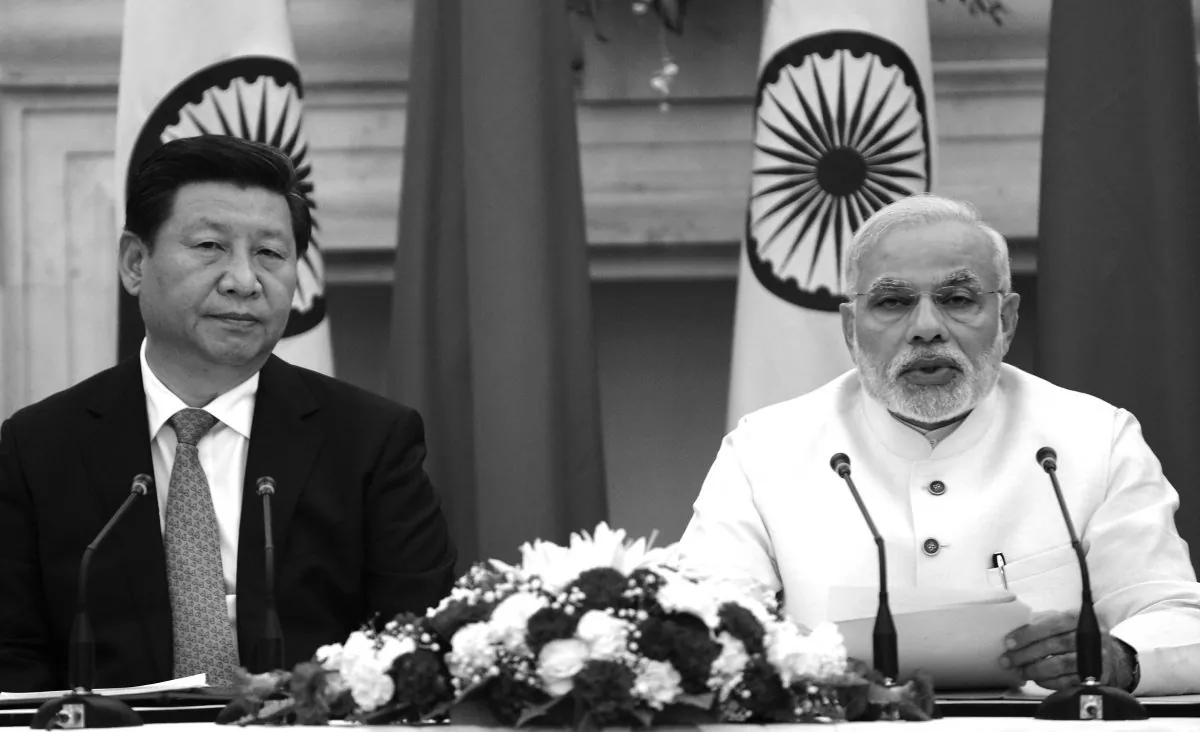Chinese leader Xi Jinping (L) speaks at joint press conference with Indian Prime Minister Narendra Modi in New Delhi on Sept. 18, 2014, India’s prime minister expressed concern about incidents on the two countries’ disputed border, as a standoff between troops at the frontier overshadowed key talks. (Raveendran/AFP/Getty Images)