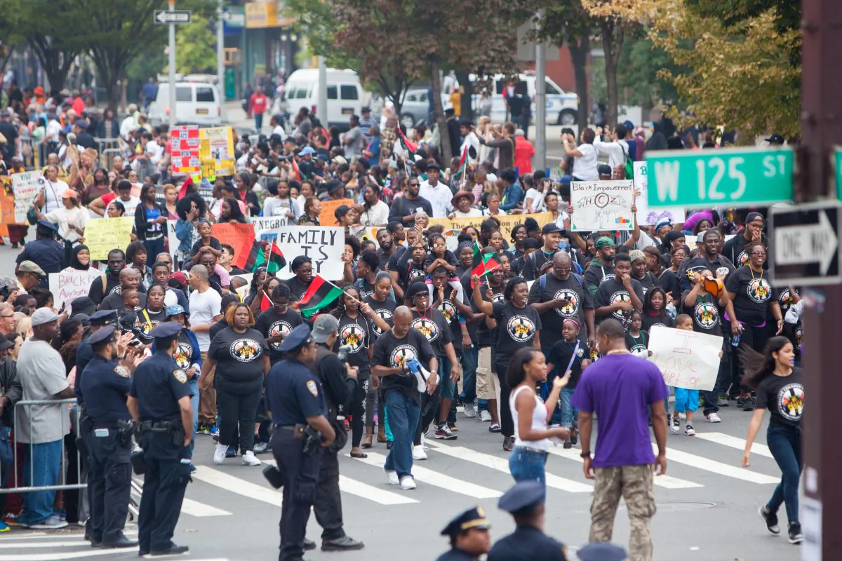 Participants march in the African-American Day Parade in Harlem, New York City, on Sept. 21, 2014. (Petr Svab/Epoch Times)