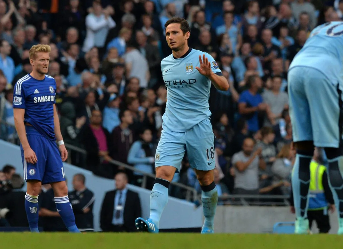 Frank Lampard acknowledges the crowd after scoring the equalizer in English Premier League action between Manchester City and Chelsea at the Etihad Stadium in Manchester on September 21, 2014. (Paul Ellis/AFP/Getty Images)