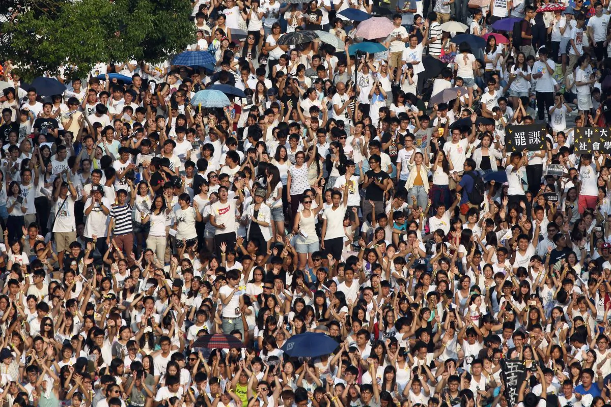 Around 13,000 students from 25 universities and colleges rallied in Hong Kong on Sept. 22. The event began a week-long boycott of classes in protest of Beijing's control over the selection of candidates for the chief executive. (Pan Zaishu/Epoch Times)