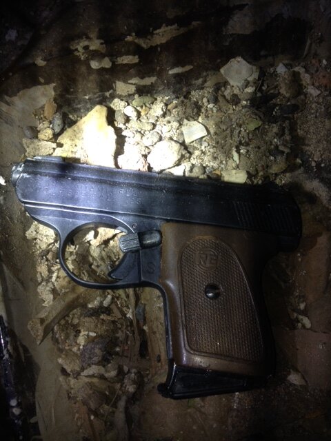 Officers found a .25 caliber semi-automatic handgun when searching the premises where Clinton Lawson, 29, was found in Brooklyn on July 19, 2014. (DCPI)