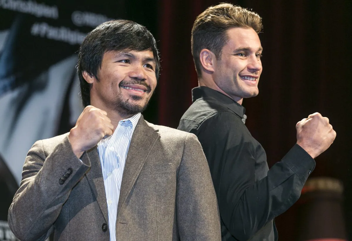 Boxers Manny Pacquiao, left, and Chris Algieri pose for a photo in Los Angeles, Wednesday, Sept. 3, 2014. They will fight for Pacquiao's WBO welterweight title at The Venetian Macao hotel on Nov. 22. (AP Photo/Damian Dovarganes)