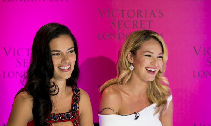 Victoria's Secret models Adriana Lima and Candice Swanepoel during a press conference at the Victoria's Secret New Bond Street store in central London, Tuesday, April 15, 2014. (Photo by John Phillips/Invision/AP)