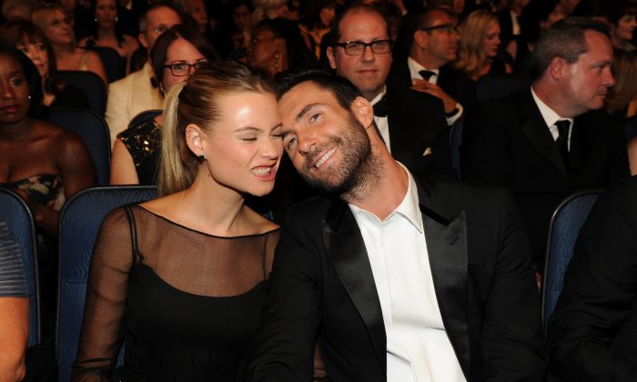 Model Behati Prinsloo, left, and singer Adam Levine in the audience at the 66th Primetime Emmy Awards at the Nokia Theatre L.A. Live on Monday, Aug. 25, 2014, in Los Angeles. (Photo by Frank Micelotta/Invision for the Television Academy/AP Images)
