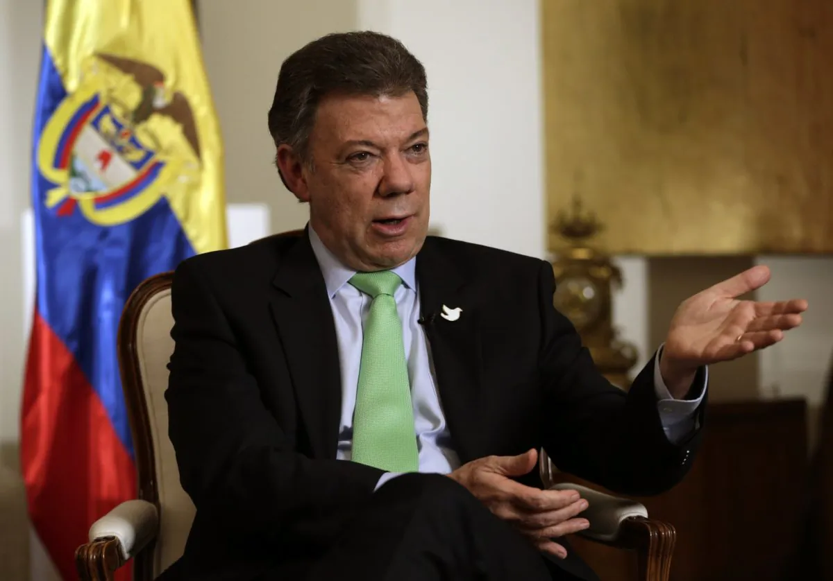 Colombian President Juan Manuel Santos talks to The Associated Press, Tuesday, Sept. 23, 2014, in New York. (AP Photo/Julio Cortez)