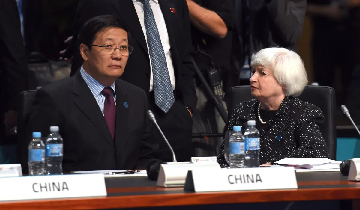 China’s finance minister Lou Jiwei talks with U.S. Federal Reserve chair Janet Yellen at the G20 Finance Ministers and Central Bank Governors Meeting in Cairns, Australia, on Sept. 20, 2014. (William West/AFP/Getty Images)