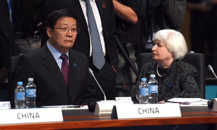 China’s finance minister Lou Jiwei talks with U.S. Federal Reserve chair Janet Yellen at the G20 Finance Ministers and Central Bank Governors Meeting in Cairns, Australia, on Sept. 20, 2014. (William West/AFP/Getty Images)