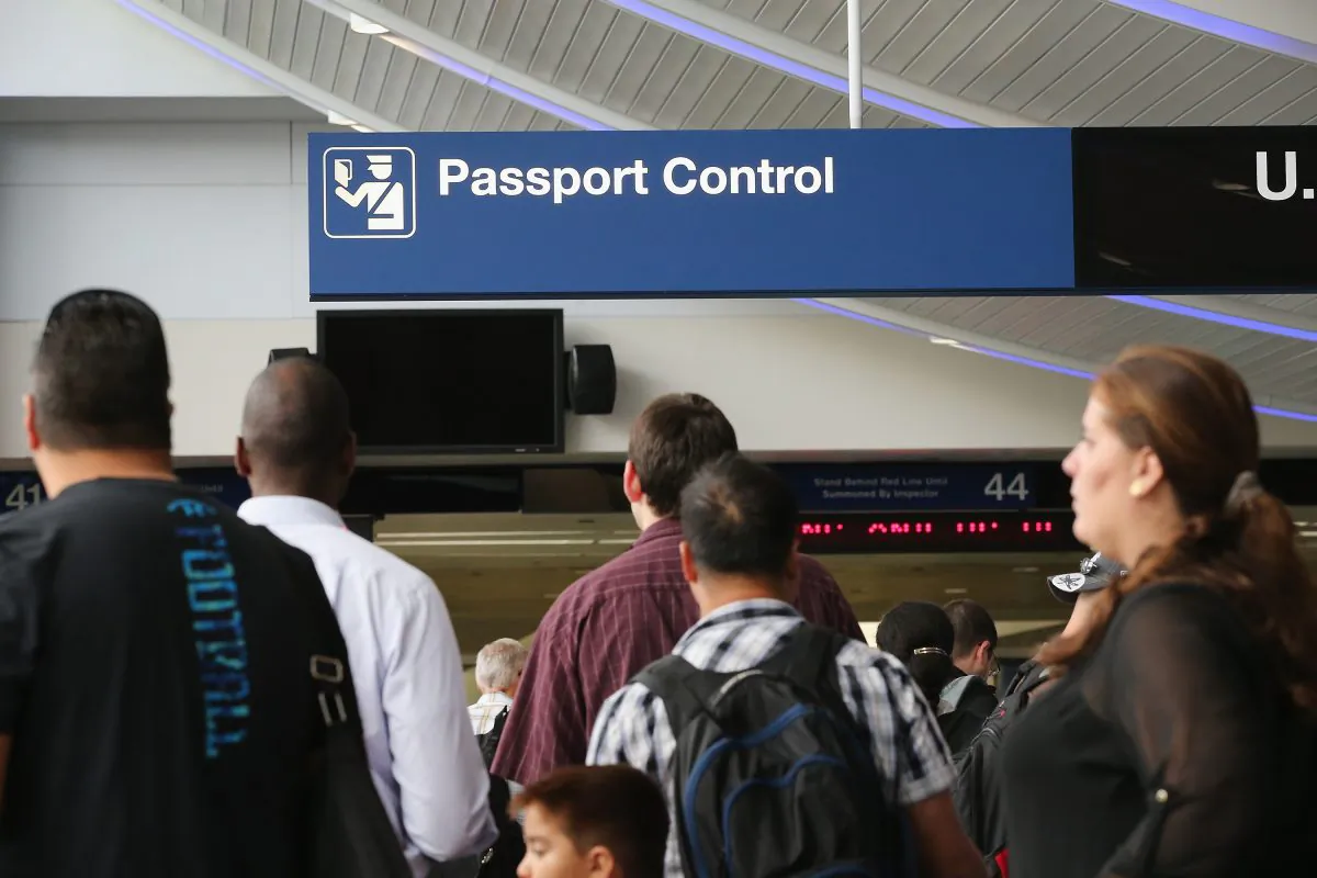 International travelers wait to have their passports checked at O'Hare International Airport in Chicago on Sept. 19, 2014. (Scott Olson/Getty Images)