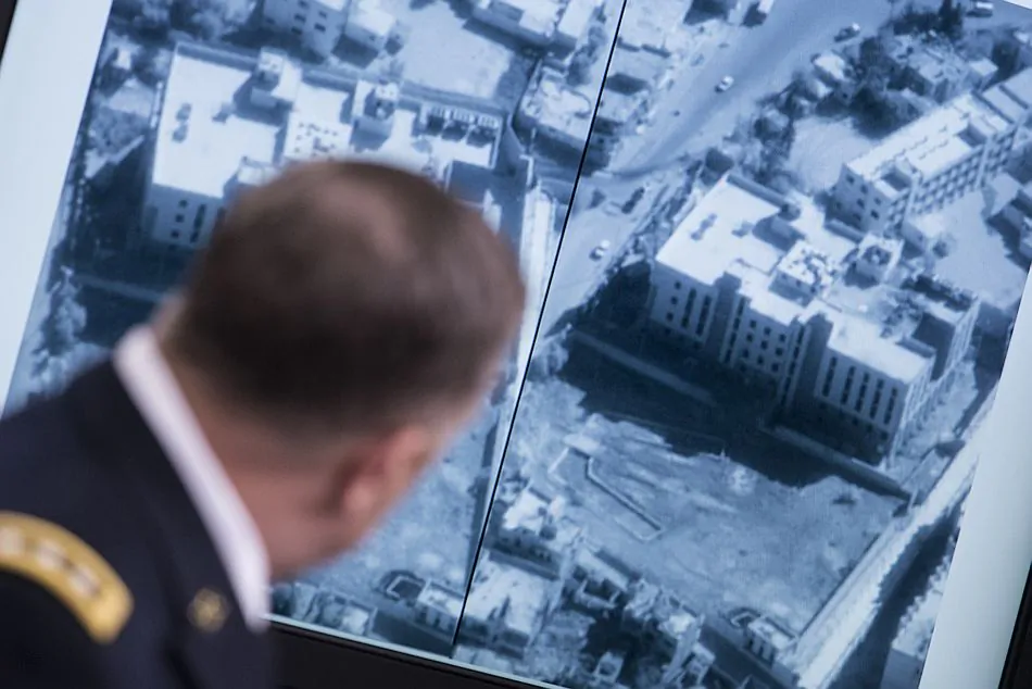 Lt. Gen. William C. Mayville Jr., joint staff director of operations, shows before and after photos of the airstrikes in Syria during a briefing at the Pentagon on Tuesday. (Brendan Smialowski/AFP/Getty Images)